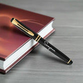 Elegant personalized black and gold pen with custom engraving, perfect for thoughtful personalized gifts